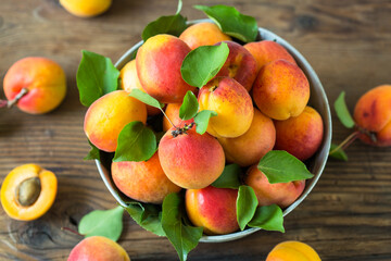Fresh organic apricots on the wooden table