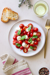 Salad with mozzarella, tomatoes, nuts and basil. Healthy eating. Vegetarian food. Diet.