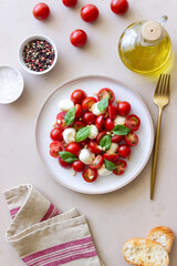 Salad with mozzarella, tomatoes, nuts and basil. Healthy eating. Vegetarian food. Diet.