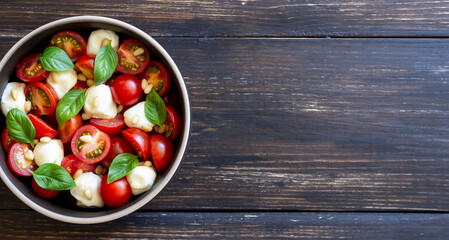 Salad with mozzarella, tomatoes, nuts and basil. Healthy eating. Vegetarian food. Diet.