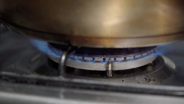 Gas Burner On The Stove Burns And Heats The Pan