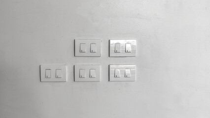 white light switch on white wall