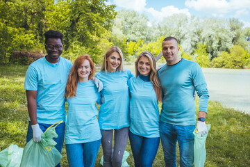Multiracial group of young people hugging and laughing at the camera - Happy different friends...