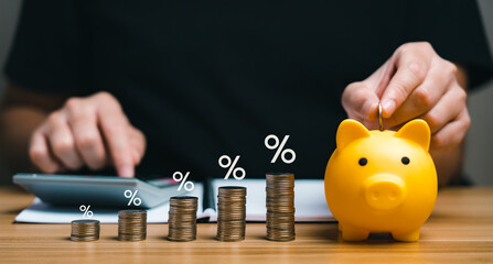 Interest rate and dividend concept. Businessman balances money in piggy bank with pile of coins and percentage symbols. Show returns from mutual funds and stocks. long term investment for retirement