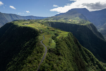Aerial view of a road on mountain at Grand Coude (Saint-Joseph), Reunion Island - obrazy, fototapety, plakaty