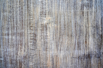 Old board painted in white color and bronze patina