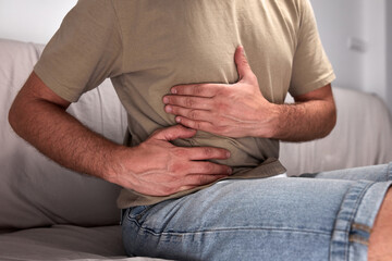 Man with stomach pain and digestive issues.