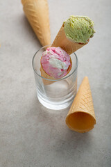 Ice cream scoops in wafer cones gelato in glass summer food