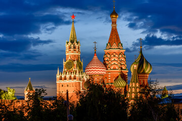 Cathedral of Vasily the Blessed (Saint Basil's Cathedral) and Spasskaya Tower of Moscow Kremlin on Red Square at sunset, Moscow, Russia