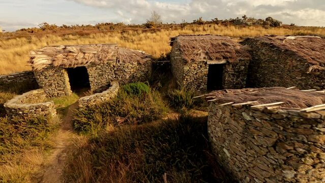 Castromao Celanova ancient cabins in Galicia Spain, aerial drone circle pan