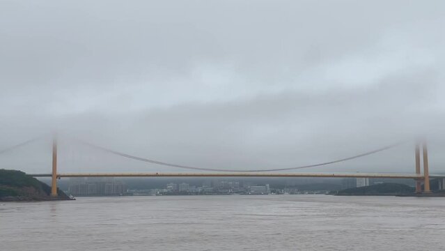 Bridge cross the sea in fog
