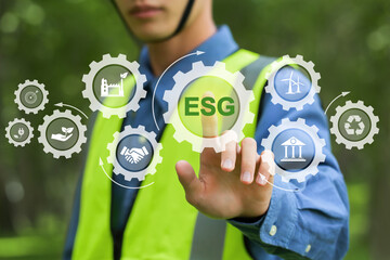 ESG concept of environmental, social, and governance. engineering touching green ESG icon and green icon idea for sustainable organizational development. ​environment, society, and governance. - obrazy, fototapety, plakaty
