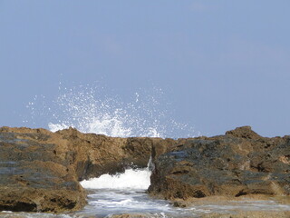 waves crashing on rocks