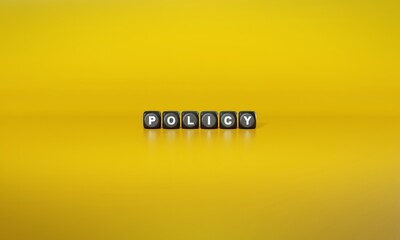 Word ‘Policy’ spelled out in white text on dark wooden blocks against plain yellow background. 3D rendering