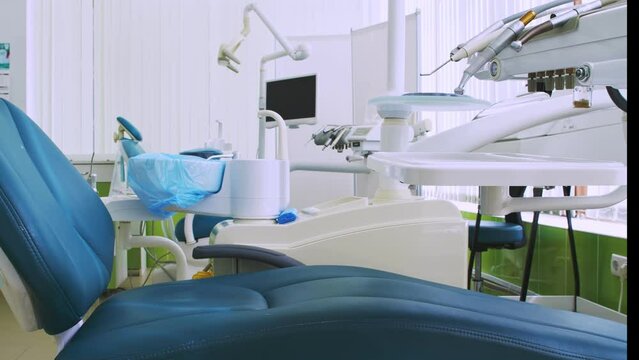 Closeup of dental clinic equipment in soothing green colors. Modern equipment and interior. Background for the commercial. Medical footage