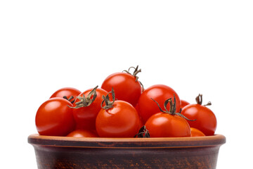 Part of bowl with pile of cherry tomatoes isolated on white background, selective focus.