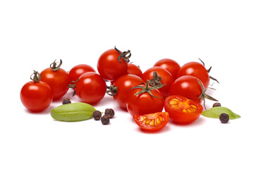 Close up of pile of small cherry tomatoes with spice on white background, selective focus.