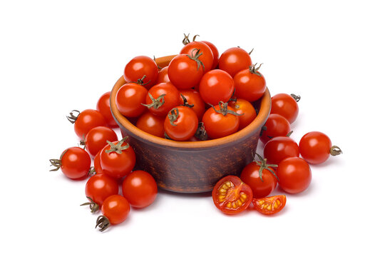 Close up of cherry tomatoes in brown bowl isolated on white background, perspective view.