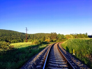 Fototapeta na wymiar Railway among forests and fields