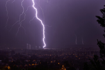 Lightning strikes a multi-story building at night