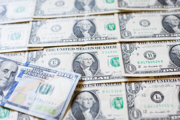 one hundred dollars on a background of one