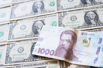 Fototapeta na wymiar Ukrainian hryvnia money on a background of dollars