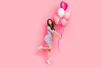Photo of flirty sweet woman wear white dress sending kiss holding air balls isolated pink color background