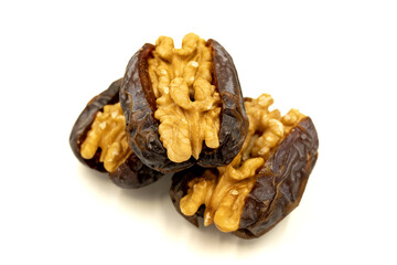 Walnut-stuffed dates isolated on white background. Close-up. Arabian luxury for special occasions such as Ramadan and Eid holidays. local name cevizli hurma