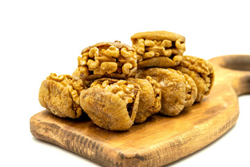 Stuffed dried figs. Dried figs stuffed with walnuts isolated on white background. Close-up. local name cevizli incir