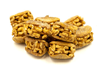 Stuffed dried figs. Dried figs stuffed with walnuts isolated on white background. Close-up. local name cevizli incir