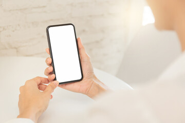 cell phone blank white screen mockup.hand holding texting using mobile on desk at office.background empty space for advertise.work people contact marketing business,technology