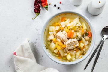 Comfort foos, slow cooker pork vegetable soup. Top view, copy space, flat lay.