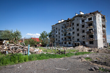 Playground and apartment building destroyed by the Russian army as a result of Russia's invasion of...
