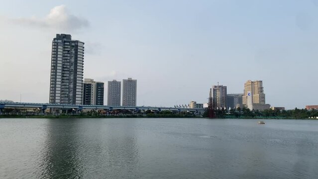 Scenic shot of a lake at Kolkata with beautiful building in the background.