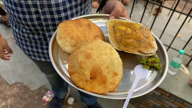 Club Kochuri, kachori of kachauri is a spicy snack, fried dumpling and a very popular street food available at Sharma snacks at Kolkata, India.