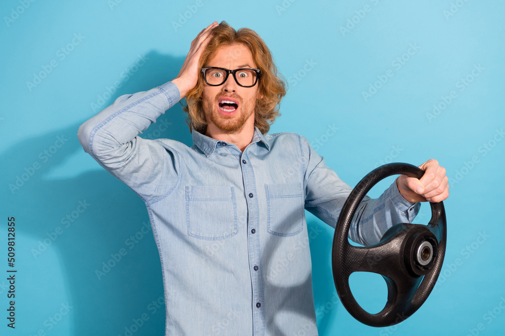 Canvas Prints Photo of puzzled confused person hand touch head hold wheel stare speechless isolated on blue color background