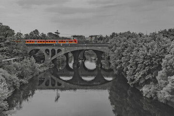 bridges over the Brda River, red train, black and white
