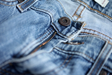 Jeans denim texture close up , focus only one point , soft blured background wallpaper