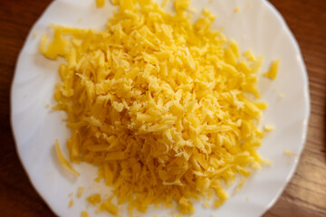 Finely chopped cheese for homemade pizza.