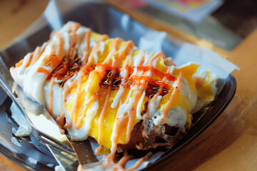 Roti bakar or toast bread is a baked Malaysian sandwich consisting of two slices of bread and stuffing, such as sugar, margarine, butter, egg and jam