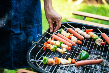 People hand grill BBQ in food party home garden