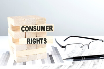 CONSUMER RIGHTS is written on wooden blocks on a chart background