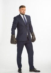 businessman in a business suit and boxing gloves posing on a white background isolated in full growth with a variety of emotions