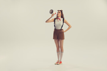 Young beautiful charming girl retro, 70s, 80s fashion style clothes, vintage outfit posing isolated...