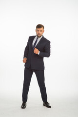 Obraz na płótnie Canvas young businessman in a suit posing with different emotions on a white background in the studio isolated in full growth
