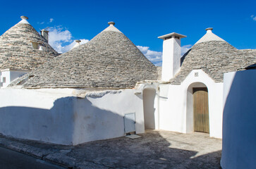 Fototapeta na wymiar I trulli, tipiche abitazioni della zona di Alberobello, lungo la Via Peuceta del Cammino Materano