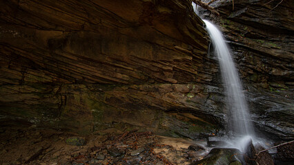 Fototapeta na wymiar Stone Cavern Waterfall