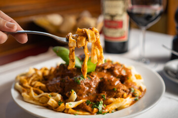 a fork holding noodles