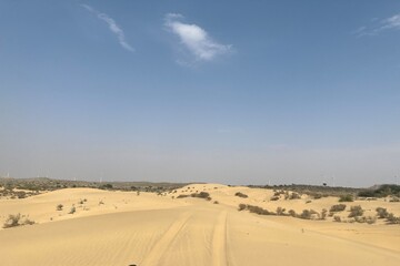 Fototapeta na wymiar Tire tracks on desert sand. Beautiful Thar desert. 