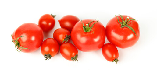 Red ripe tomatoes on a white background. Juicy vegetables.
